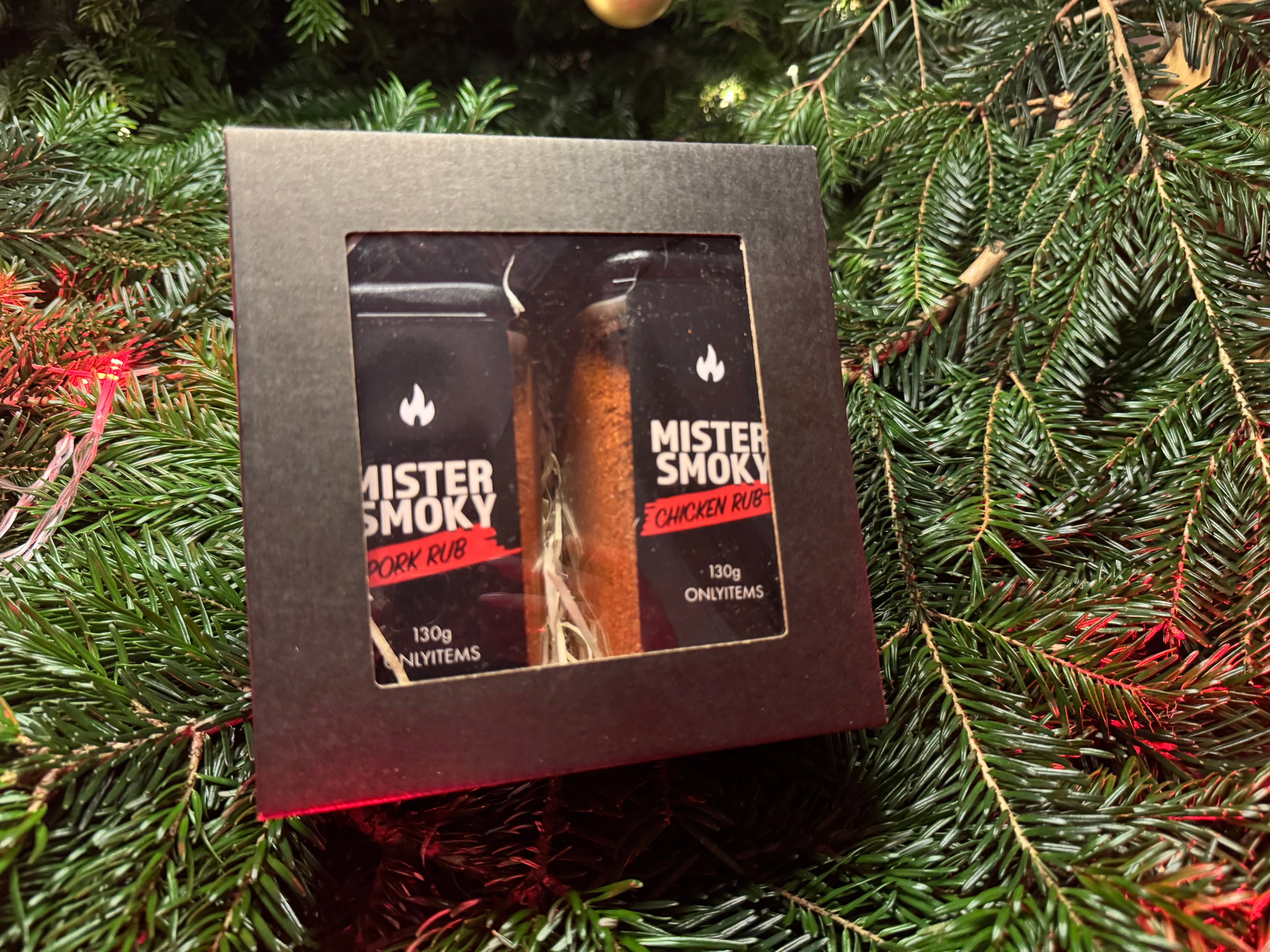 Mister Smoky chicken rib packaging on a Christmas tree background